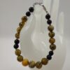 Elegante Bracciale in Pietra Onice Nera e Agata Maculata - immagine 3